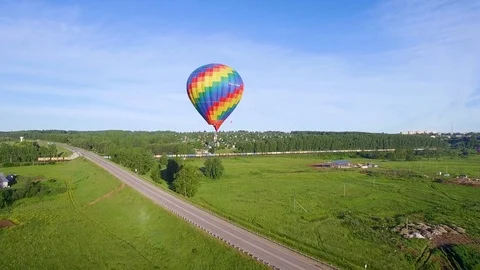 Hanging in one place  bright balloon and  passing train aerial video 스톡 동영상 80280469