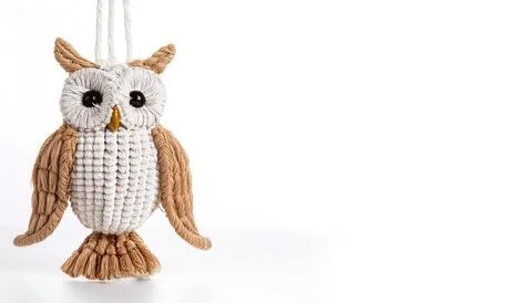 Hanging owl Macrame is a form of textile produced using knotting rather tha.. Stock Photos