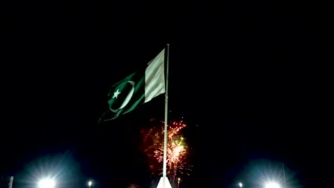 Hanging Pakistan flag on firework sky bokeh background (12) Stock Footage 284446145