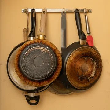 Hanging pans and kitchenware Stock Photos
