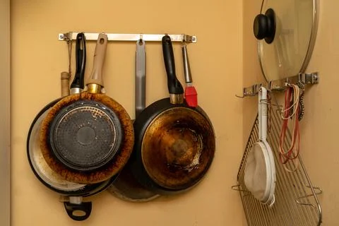 Hanging pans and kitchenware Stock Photos