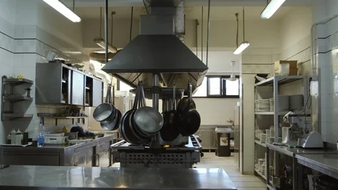 Hanging pans and pots in the kitchen Stock Footage 86203344