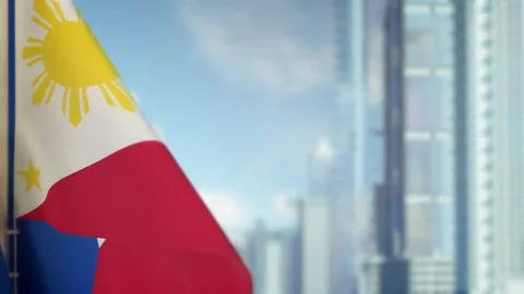 Hanging Philippines flag on city background with blue sky Stock Footage 273842443