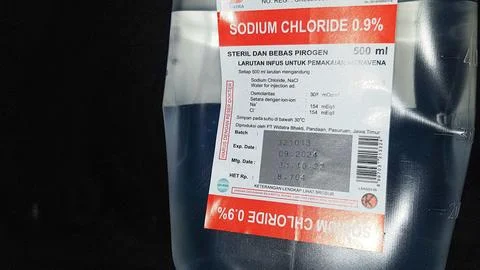 Hanging pillar and Saline solution fluid iv bag in emergency room at hospital Stock Photos