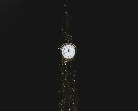 Hanging pocket watch falling sequins. High quality photo Stock Photos