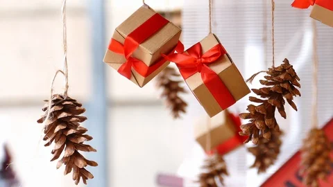 Hanging presents and pine cones Stock Footage 99689115