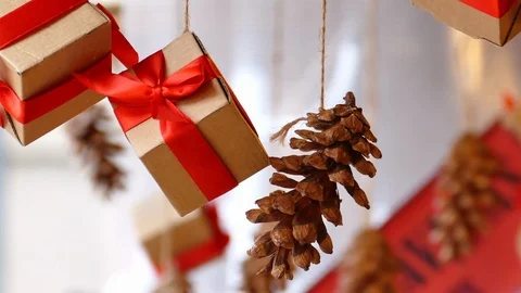Hanging presents and pine cones 動画素材 99696345