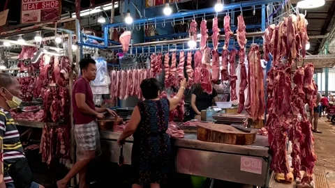 Hanging Raw Beef and Pork Meat in a Shop in Marikina City Public Market Stock Footage 235884607