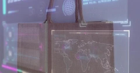 Hanging rectangular fabric tote bag displaying projected world map and HUD 스톡 사진