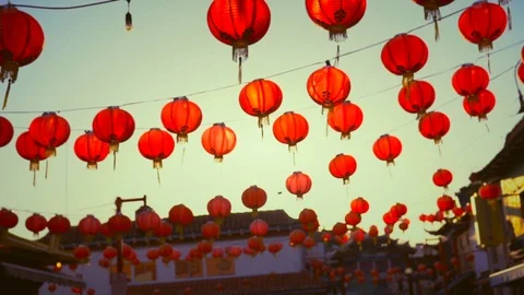 Hanging red Chinese lantern in evening sky Stock Footage 89907887