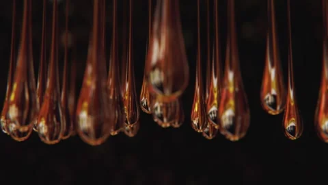 Hanging reflection drops in slow motion and macro Stock Footage 265086218