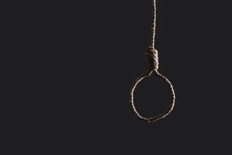 Hanging rope with loop on dark background. Suicide concept Stock Photos