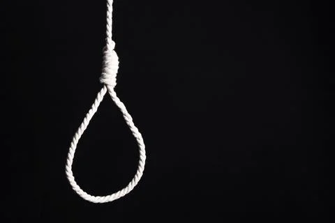 Hanging rope with loop on dark background. Suicide concept Stock Photos