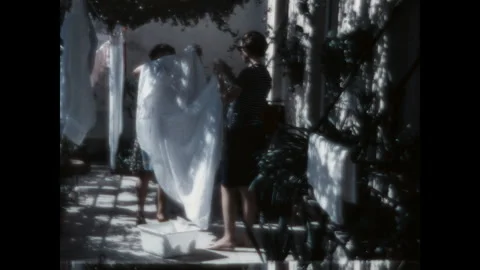 Hanging a Sheet to Dry 1968 Stock Footage 265539244