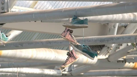 Hanging shoes Stock Footage 79214604
