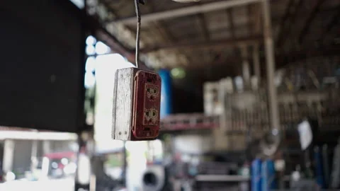 Hanging socket in an industrial plant - Back lit Stock Footage 232586712
