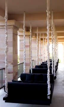 Hanging sofas as a part of cafe interior Stock-Fotos