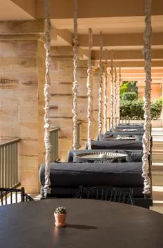 Hanging sofas as a part of cafe interior Stock Photos