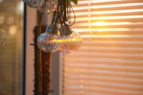 Hanging String Lights with Blinds in Background Stock Photos
