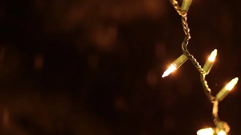 Hanging string lights swinging gently Stock Footage 306415572