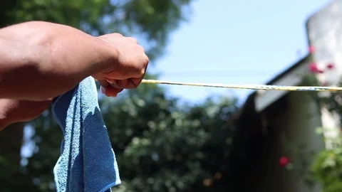 Hanging stuff on the laundry line 스톡 동영상 124519426
