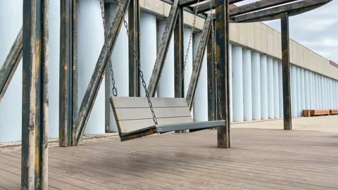 Hanging swing on chain in park. Video stock 227578289