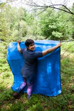 Hanging up a tarp Stock Photos