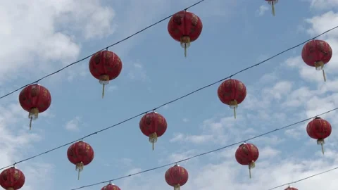 Hanging traditional red lanterns during Chinese New Year Stock Footage 135968024