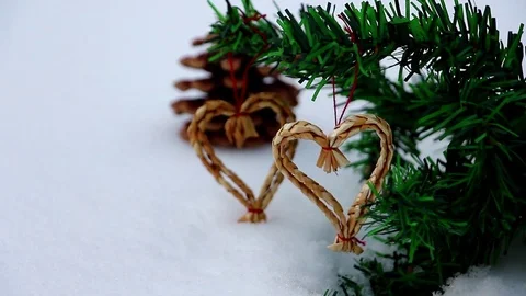 Hanging two hearts on tree with snow around Stock Footage 72476173
