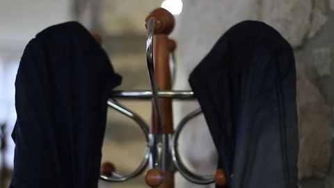 Hanging two jackets on a rack 動画素材 71952608
