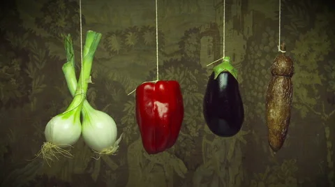 Hanging vegetables swing gently on string Stock Footage 41773093
