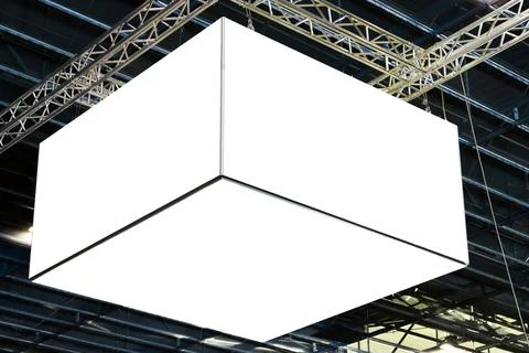 Hanging white empty indoor billboard in the exhibition hall. Fairground, market Stock Photos