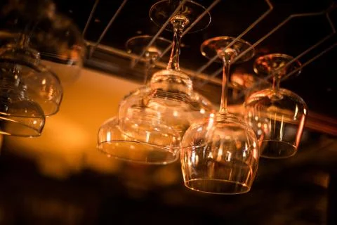 Hanging wine glasses in a pub Stock Photos