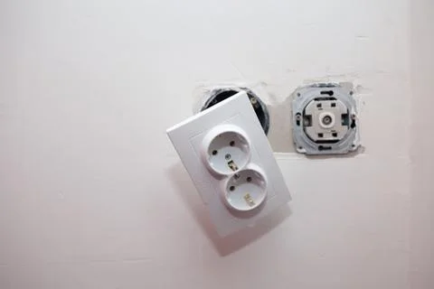 Hanging on the wire socket. repair, electrical device in the house Stock Photos