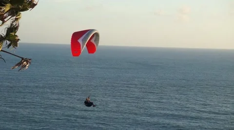 Hanglider flyung opposite sunset Stock Footage 54065622