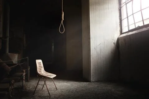 Hangman noose with thirteen loops setup in an abandoned building Stock Photos