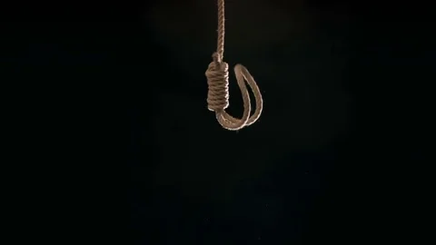 Hangmans noose falling into frame at 120 fps against black background Vídeo Stock 72575178