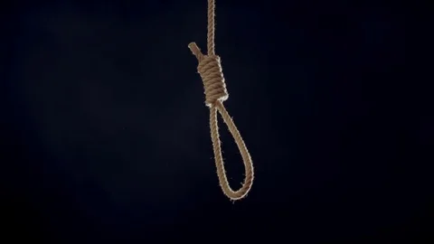 Hangmans noose falling into frame hard lit from behind Vídeo Stock 72575180