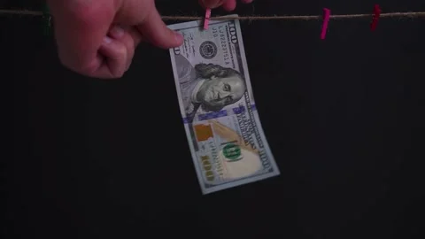 Hangs money. Black background. Variable focus. Stock Footage 174300279