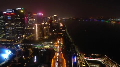 Hangzhou city downtown night illumination traffic bay aerial panorama 4k china Stock Footage 125489792
