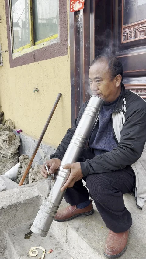 Hani Tribe man smokes pipe. Stock Footage 316453835