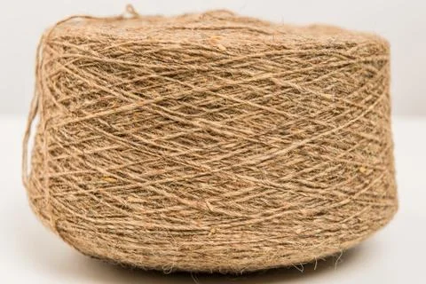 Hank of brown wool thread close-up on a white background Stock Photos
