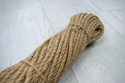 Hank rope pattern isolated on a wood background. Skein sisal macro texture. 스톡 사진