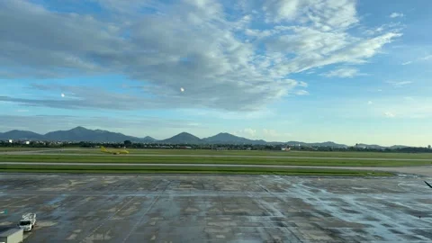 Hanoi, Vietnam – 2025, Sep 27: Aircraft Taxiing on Distant Runway Video stock 342593053