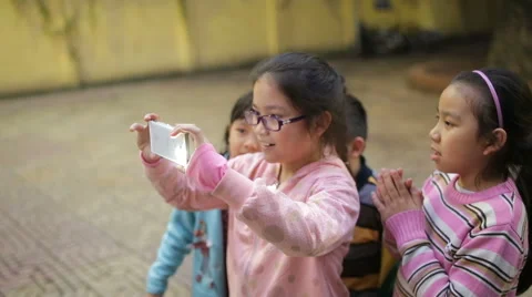 Hanoi, Vietnam  Children Using Mobile Phone Stock Footage 59578021