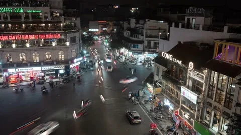 Hanoi, Vietnam: Time lapse of intersection Traffic with light trails by night. Stock Footage 231112696