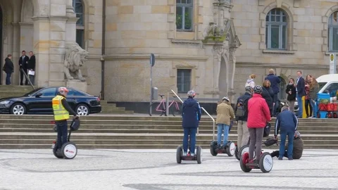 HANOVER, GERMANY - MAY, 09, 2017: people on Segways on the street Vídeos de archivo 77111304