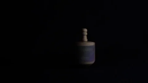 Hanukkah Dreidel Spinning on black Stock Footage 83211050