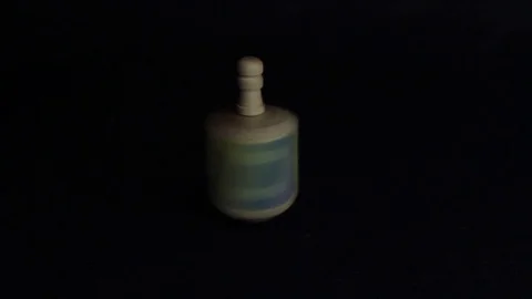 Hanukkah Dreidel Spinning on black Stock Footage 83211225