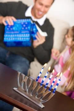 Hanukkah:  father opens hanukkah gift Stock Photos